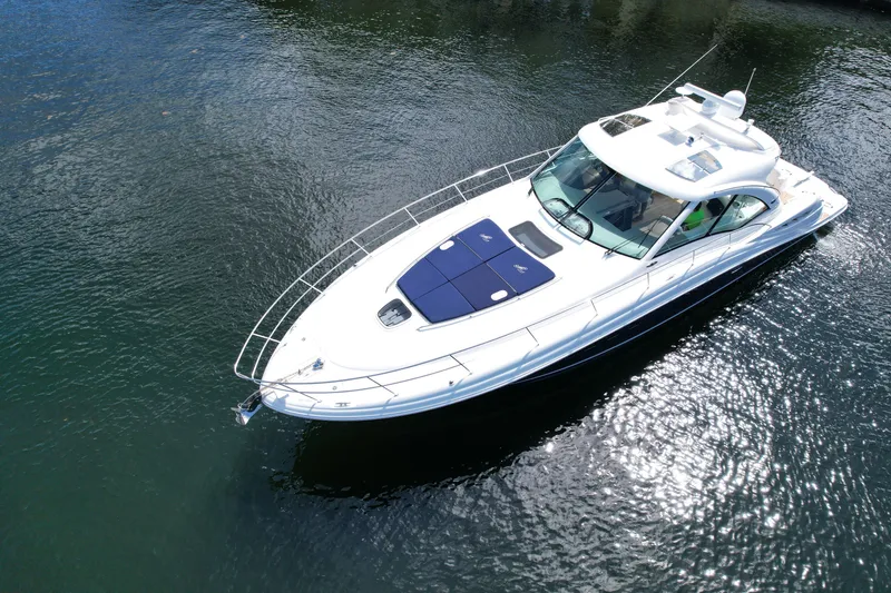 Slide: The Image of 2007 Sea Ray 48 Sundancer yacht cruising on calm water, aerial view. - 3
