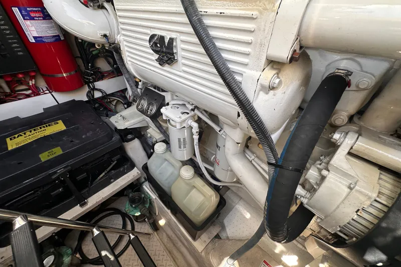 Slide: The Image of Engine room of a 2007 Sea Ray 48 Sundancer with visible components and wiring. - 69