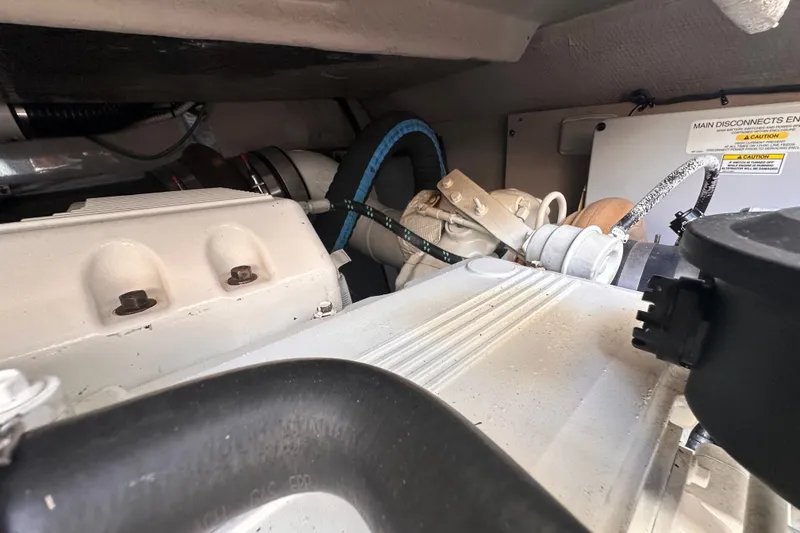Slide: The Image of Engine compartment of a 2007 Sea Ray 48 Sundancer, showcasing mechanical components. - 81