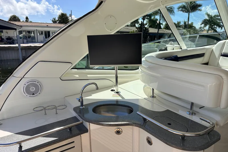 Slide: The Image of Luxurious 2007 Sea Ray 48 Sundancer yacht interior with sleek kitchenette and modern amenities. - 14