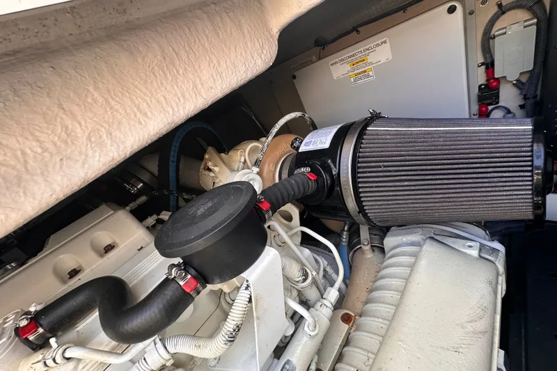 Slide: The Image of Engine compartment of a 2007 Sea Ray 48 Sundancer boat, showcasing mechanical components. - 80