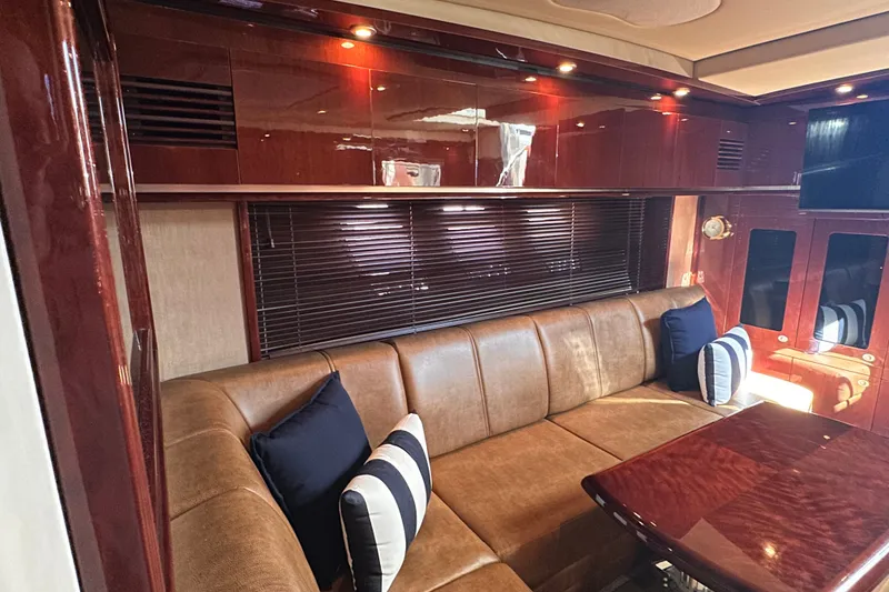 Slide: The Image of Luxurious interior of 2007 Sea Ray 48 Sundancer yacht with leather seating and wood finishes. - 37