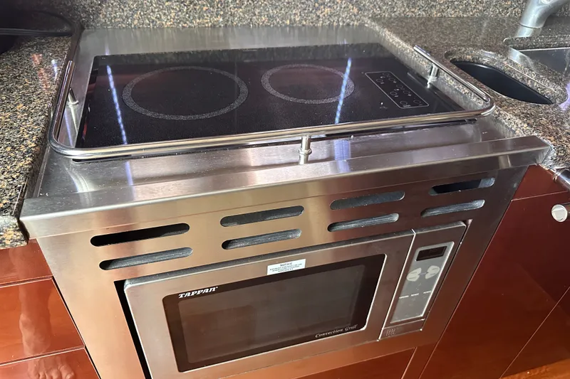 Slide: The Image of Stainless steel kitchen appliances on a 2007 Sea Ray 48 Sundancer yacht. - 55