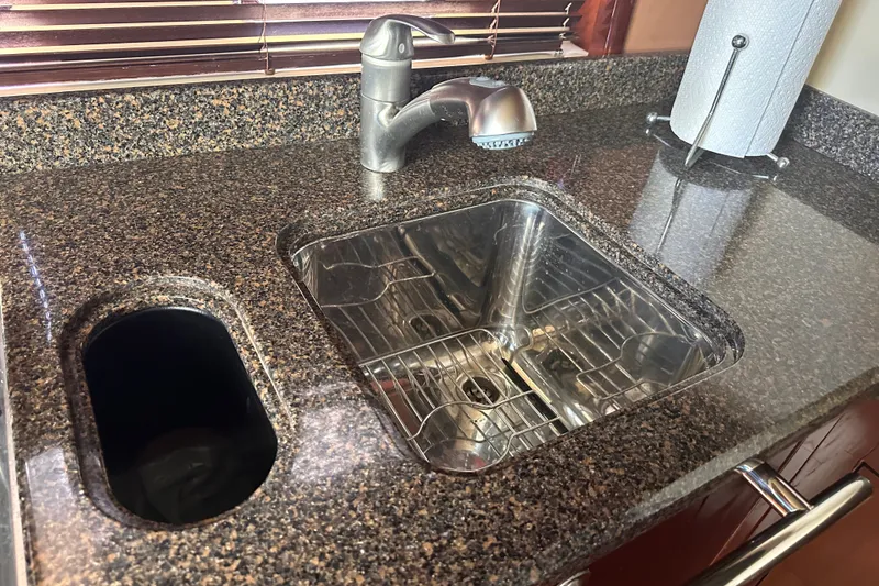 Slide: The Image of Granite countertop with stainless steel sink in 2007 Sea Ray 48 Sundancer yacht. - 56