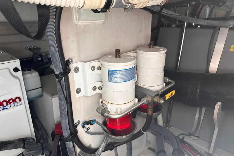 Slide: The Image of Engine room of 2007 Sea Ray 48 Sundancer with diesel fuel filters and hoses. - 65