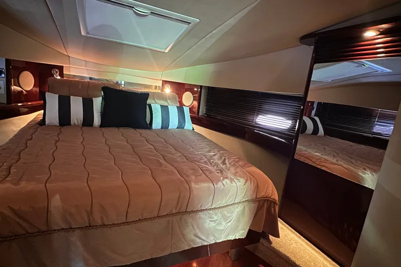 Slide: The Image of Luxurious bedroom interior of 2007 Sea Ray 48 Sundancer yacht with elegant bedding and decor. - 34