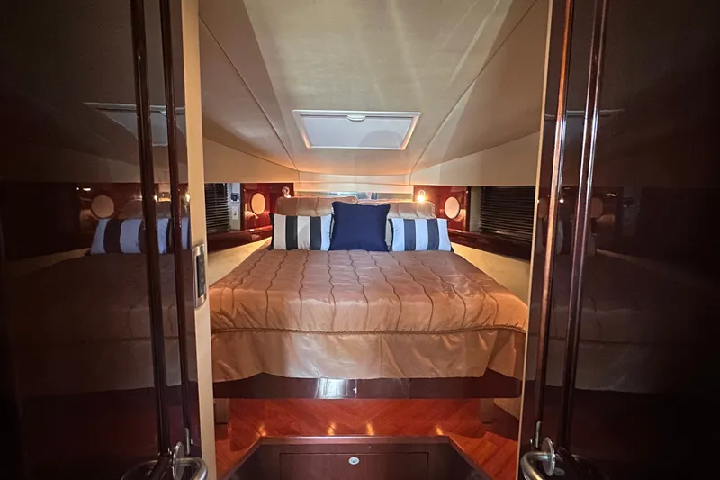 Slide: The Image of Luxurious bedroom interior of 2007 Sea Ray 48 Sundancer yacht with elegant bedding. - 36