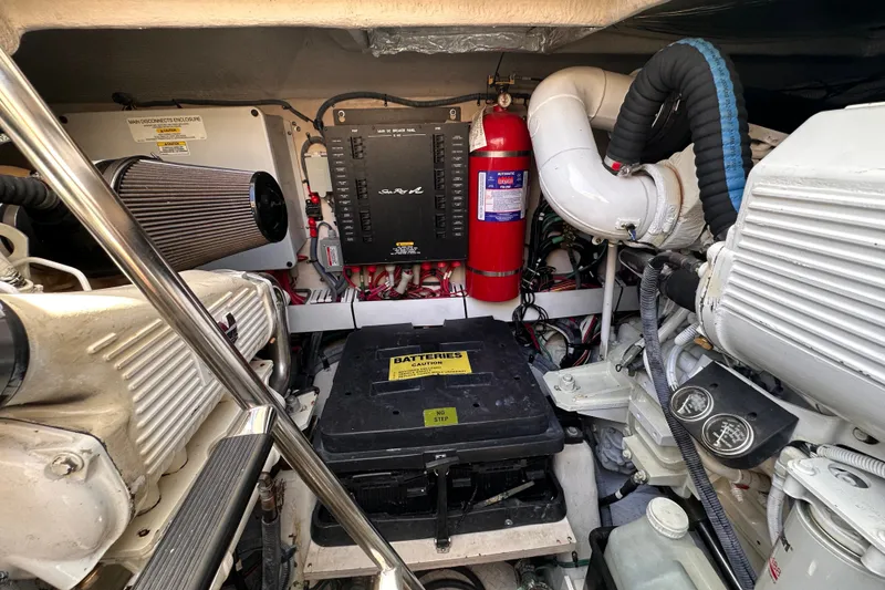 Slide: The Image of Engine room of 2007 Sea Ray 48 Sundancer with batteries and fire extinguisher. - 68