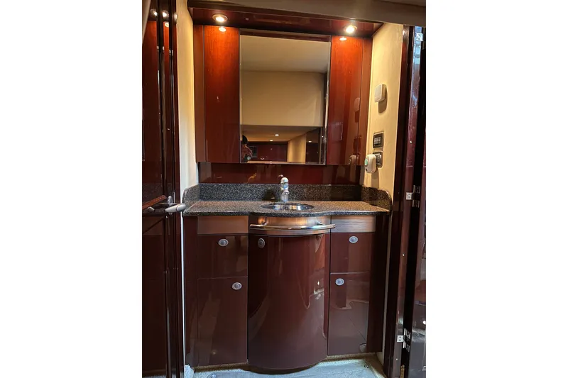 Slide: The Image of Luxurious bathroom interior of 2007 Sea Ray 48 Sundancer yacht with sleek cabinetry. - 49