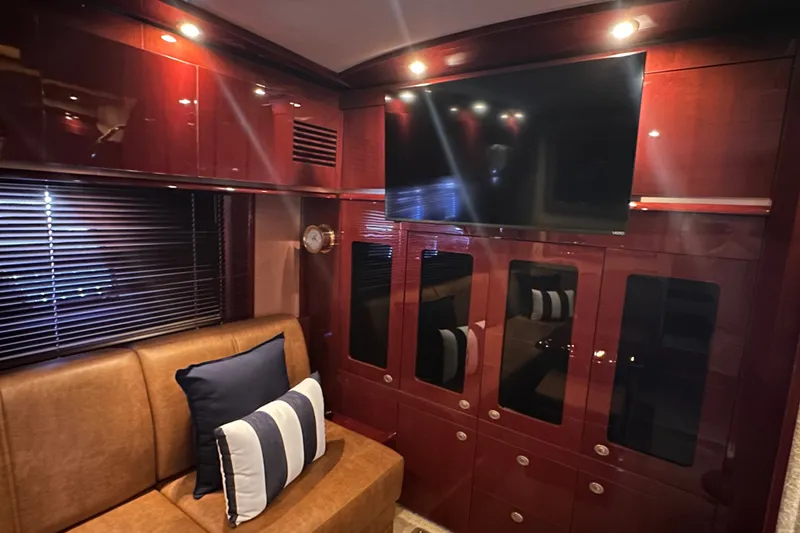 Slide: The Image of Luxurious interior of 2007 Sea Ray 48 Sundancer yacht with leather seating and modern TV. - 44