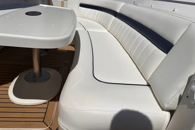 Slide: The Image of Luxury seating area on 2007 Sea Ray 48 Sundancer yacht with elegant white upholstery. - 17