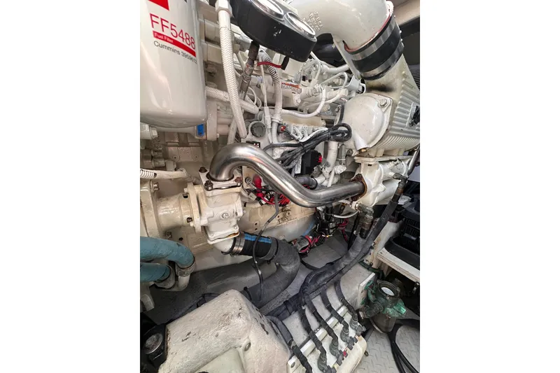 Slide: The Image of Engine compartment of a 2007 Sea Ray 48 Sundancer, showcasing detailed mechanical components. - 83