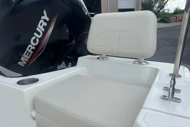 Slide: The Image of 2022 Boston Whaler 190 Montauk boat seat with Mercury engine in background. - 8