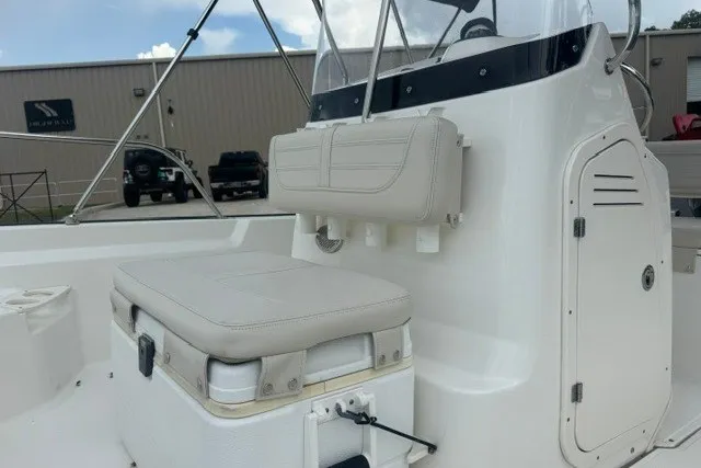 Slide: The Image of 2022 Boston Whaler 190 Montauk boat interior with seating and storage compartments. - 12