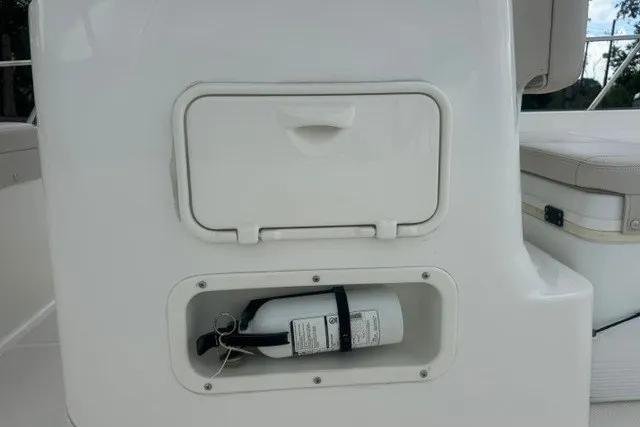 Slide: The Image of 2022 Boston Whaler 190 Montauk boat with onboard fire extinguisher storage compartment. - 15
