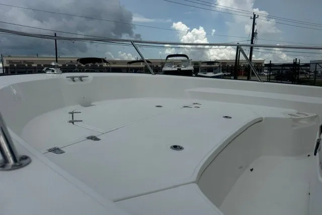 Slide: The Image of 2022 Boston Whaler 190 Montauk boat deck under cloudy sky. - 13