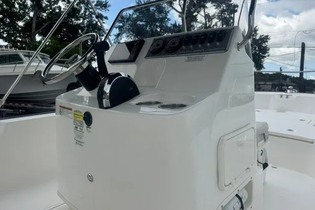 Slide: The Image of 2022 Boston Whaler 190 Montauk boat console with steering wheel and controls. - 18