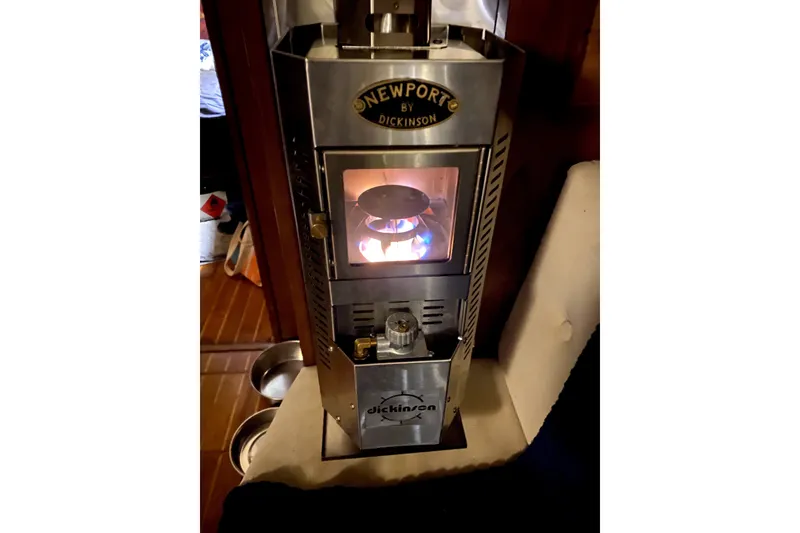 Slide: The Image of Newport by Dickinson heater inside 1989 Island Packet 35 sailboat, providing warmth and comfort. - 6
