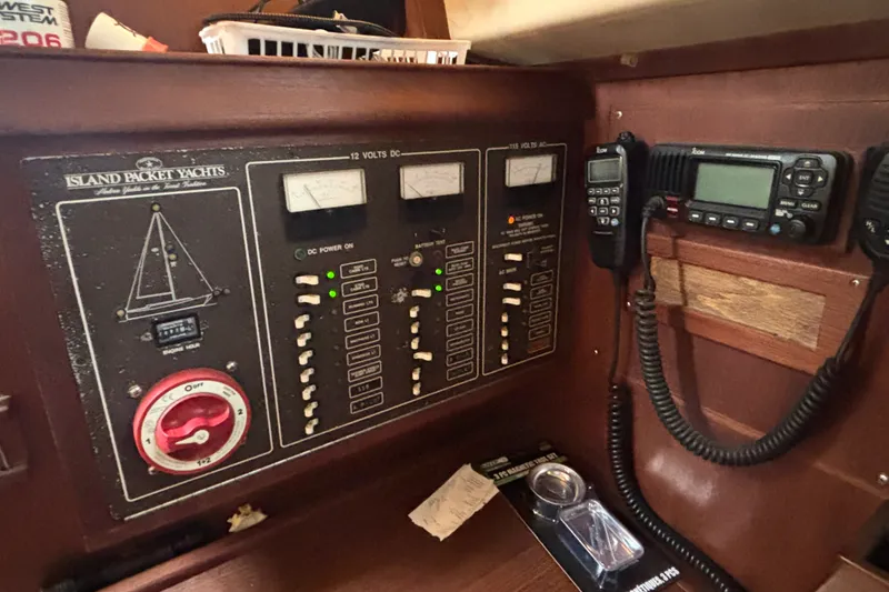 Slide: The Image of Electrical control panel of a 1989 Island Packet 35 yacht with communication devices. - 19