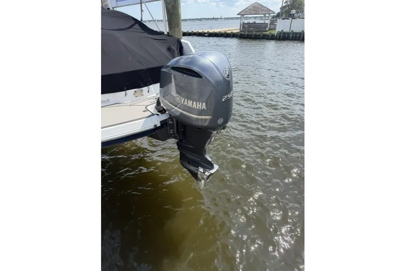 Slide: The Image of 2022 Four Winns HD5 OB with Yamaha outboard motor on water. - 1