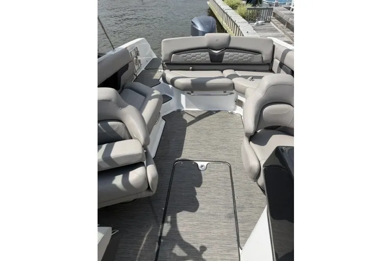 Slide: The Image of 2022 Four Winns HD5 OB boat interior with plush seating and modern design. - 26