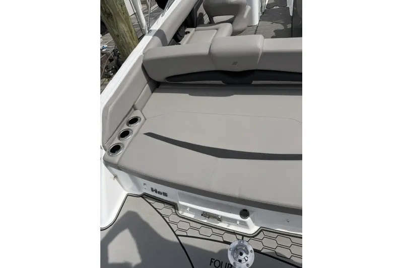 Slide: The Image of 2022 Four Winns HD5 OB boat with spacious seating and cup holders. - 19