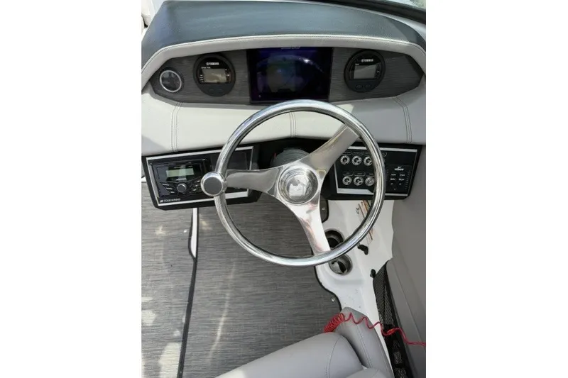Slide: The Image of Steering wheel and dashboard of 2022 Four Winns HD5 OB boat. - 5
