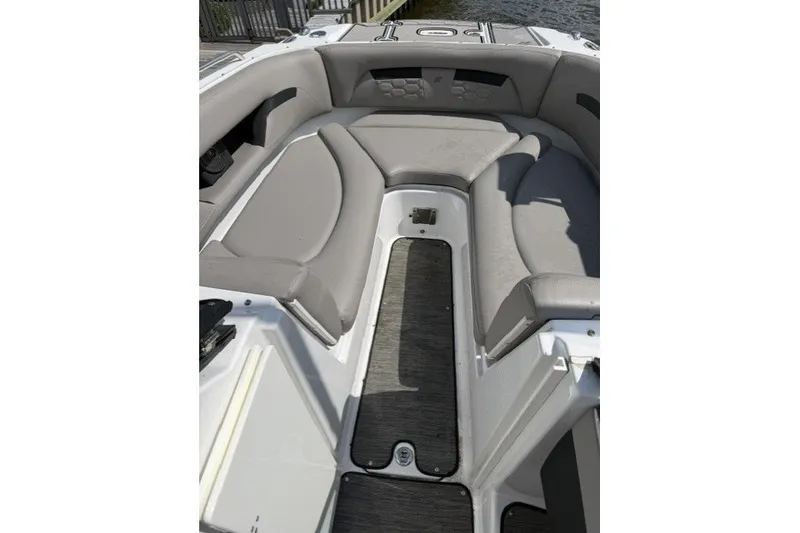Slide: The Image of 2022 Four Winns HD5 OB boat interior with gray seating and sleek design. - 14