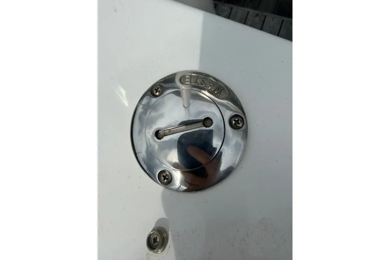 Slide: The Image of Close-up of a 2022 Four Winns HD5 OB boat waste cap. - 31
