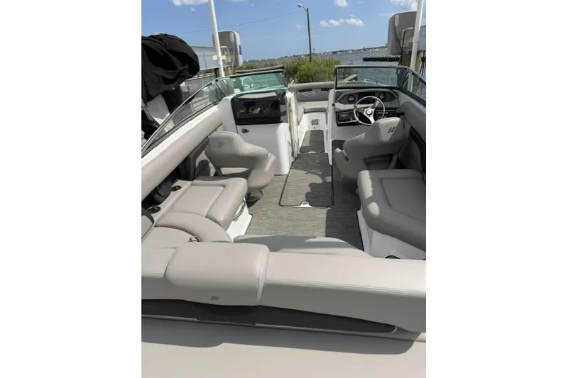 Slide: The Image of 2022 Four Winns HD5 OB boat interior with spacious seating and modern design. - 15