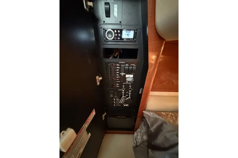 Slide: The Image of Electrical control panel inside 2003 Sea Ray Sundancer 320 boat cabin. - 34