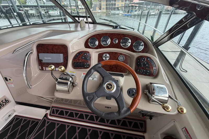 Slide: The Image of Helm of 2003 Sea Ray Sundancer 320 with wood accents and modern controls. - 22