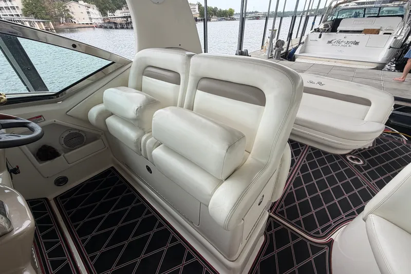 Slide: The Image of Interior of a 2003 Sea Ray Sundancer 320 with white seating and patterned flooring. - 21