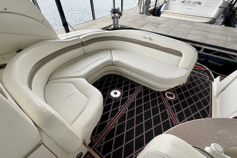 Slide: The Image of Luxurious seating area on a 2003 Sea Ray Sundancer 320 yacht, docked by the water. - 16