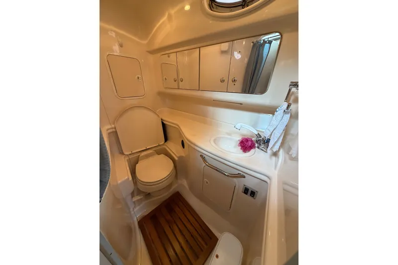 Slide: The Image of Bathroom interior of 2003 Sea Ray Sundancer 320 yacht, featuring toilet and sink. - 33