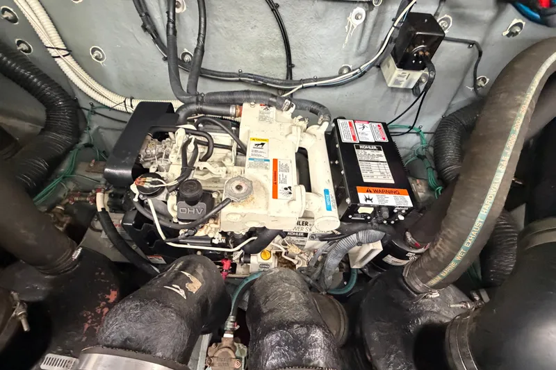 Slide: The Image of Engine compartment of a 2003 Sea Ray Sundancer 320 with visible Kohler generator. - 40
