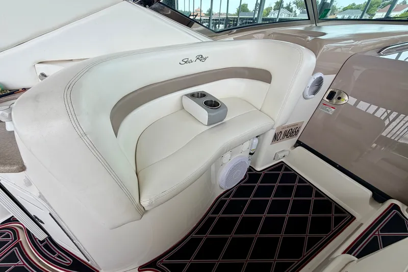 Slide: The Image of Interior seating of 2003 Sea Ray Sundancer 320 boat with cup holders and speaker. - 20