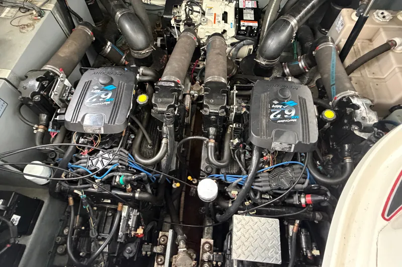 Slide: The Image of Engine compartment of a 2003 Sea Ray Sundancer 320 with twin MerCruiser 6.2L engines. - 37