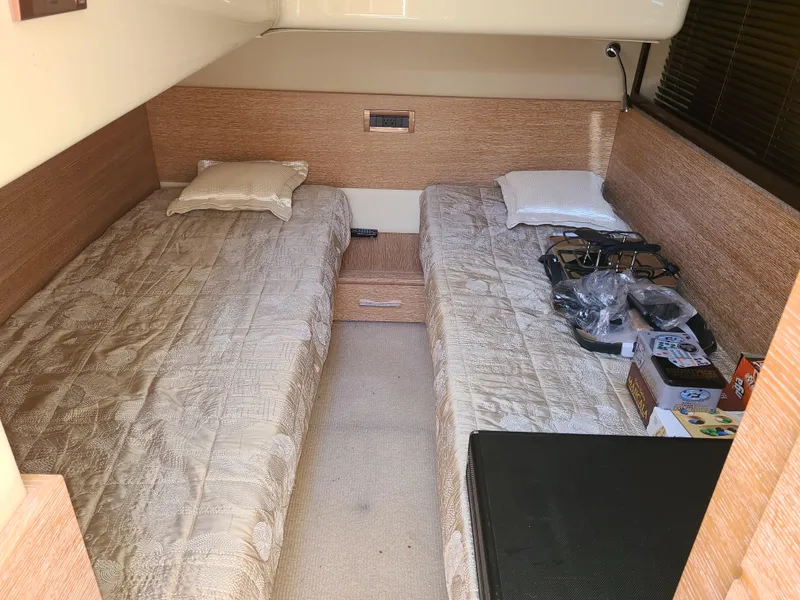 Slide: The Image of Twin bed cabin interior of 2011 Azimut 47 yacht with beige bedding. - 49