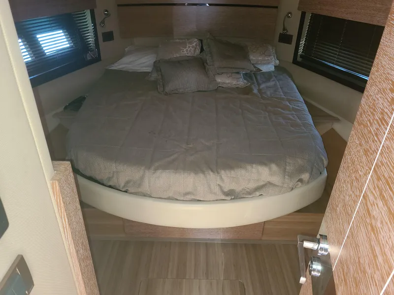 Slide: The Image of Luxurious bedroom interior of a 2011 Azimut 47 yacht with a round bed. - 42
