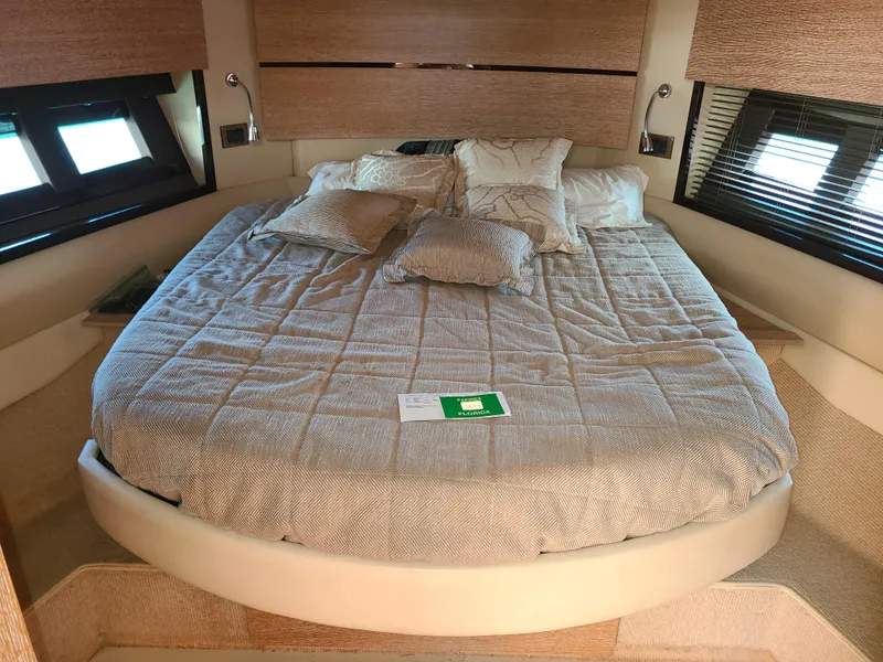 Slide: The Image of Luxurious bedroom in 2011 Azimut 47 yacht with cozy bedding and modern decor. - 41