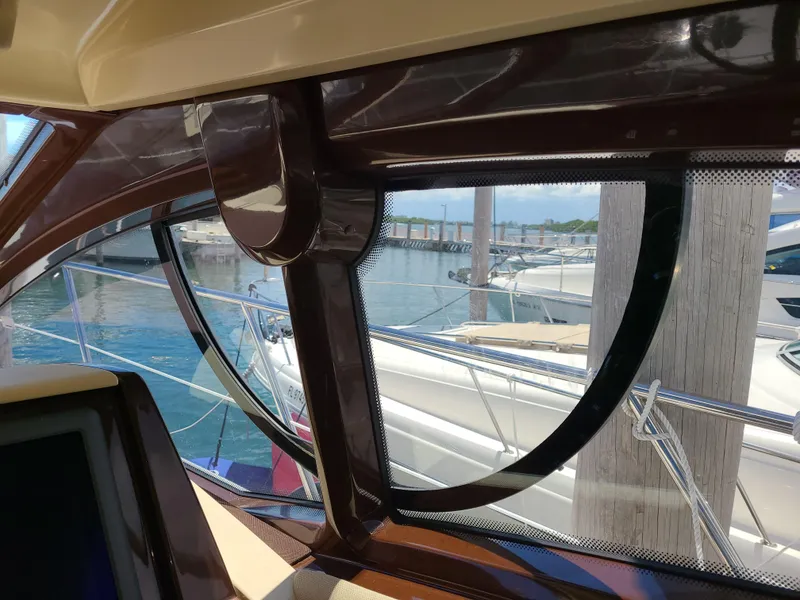 Slide: The Image of View from inside a 2011 Azimut 47 yacht, overlooking a marina. - 26
