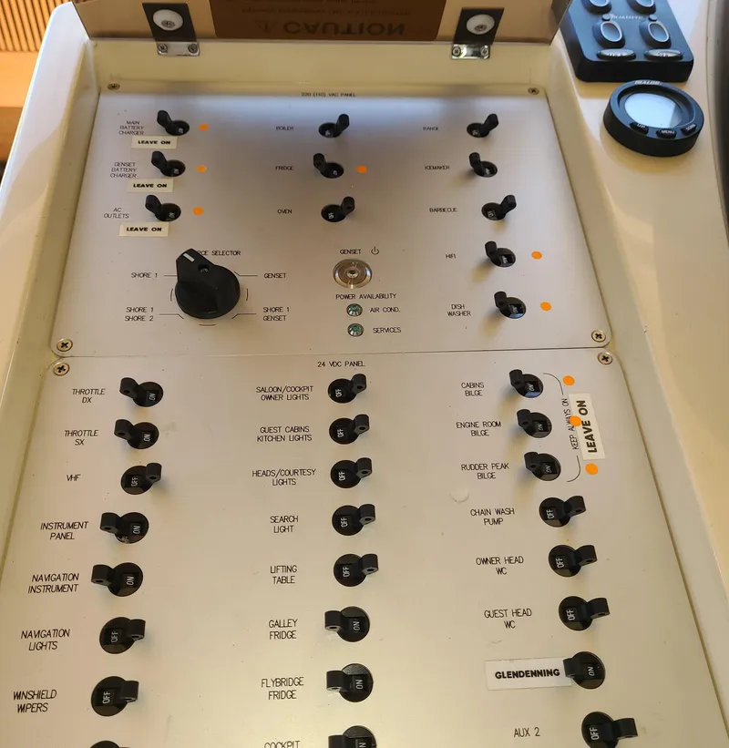 Slide: The Image of Control panel of a 2011 Azimut 47 yacht with various switches and dials. - 30