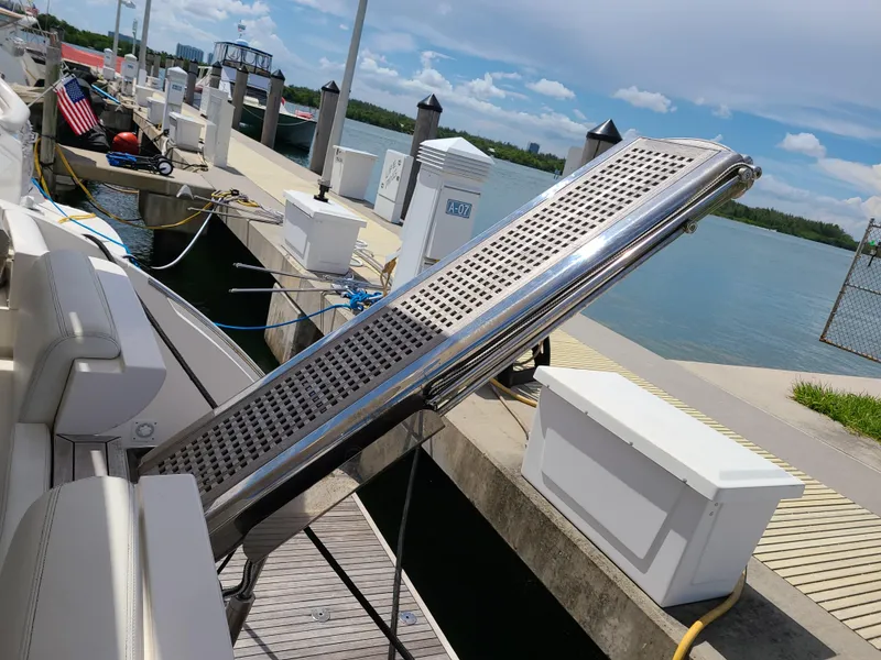 Slide: The Image of Boarding ramp of a 2011 Azimut 47 yacht docked at a marina. - 10