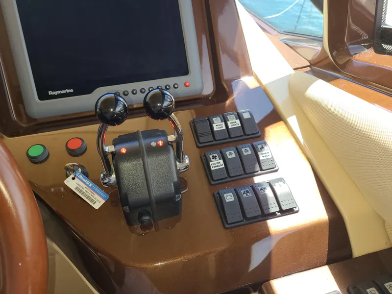 Slide: The Image of Azimut 47 yacht 2011 model control panel with throttle and navigation screen. - 17