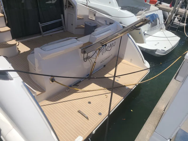 Slide: The Image of 2011 Azimut 47 yacht docked at marina, rear view. - 11