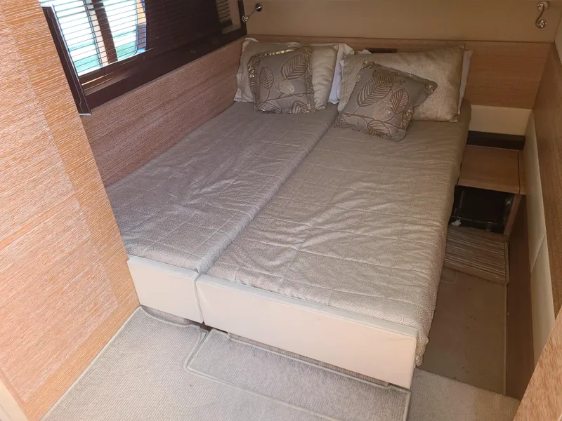Slide: The Image of Interior of a 2011 Azimut 47 featuring a cozy double bed. - 51