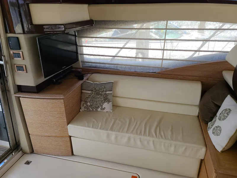 Slide: The Image of Interior of 2011 Azimut 47 yacht with cream leather sofa and TV. - 35