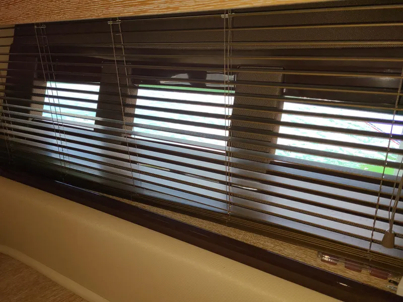 Slide: The Image of Blinds covering a window inside a 2011 Azimut 47 yacht. - 48