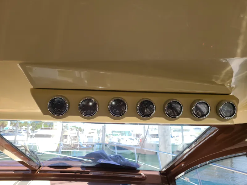 Slide: The Image of Dashboard gauges on a 2011 Azimut 47 yacht with marina view. - 25
